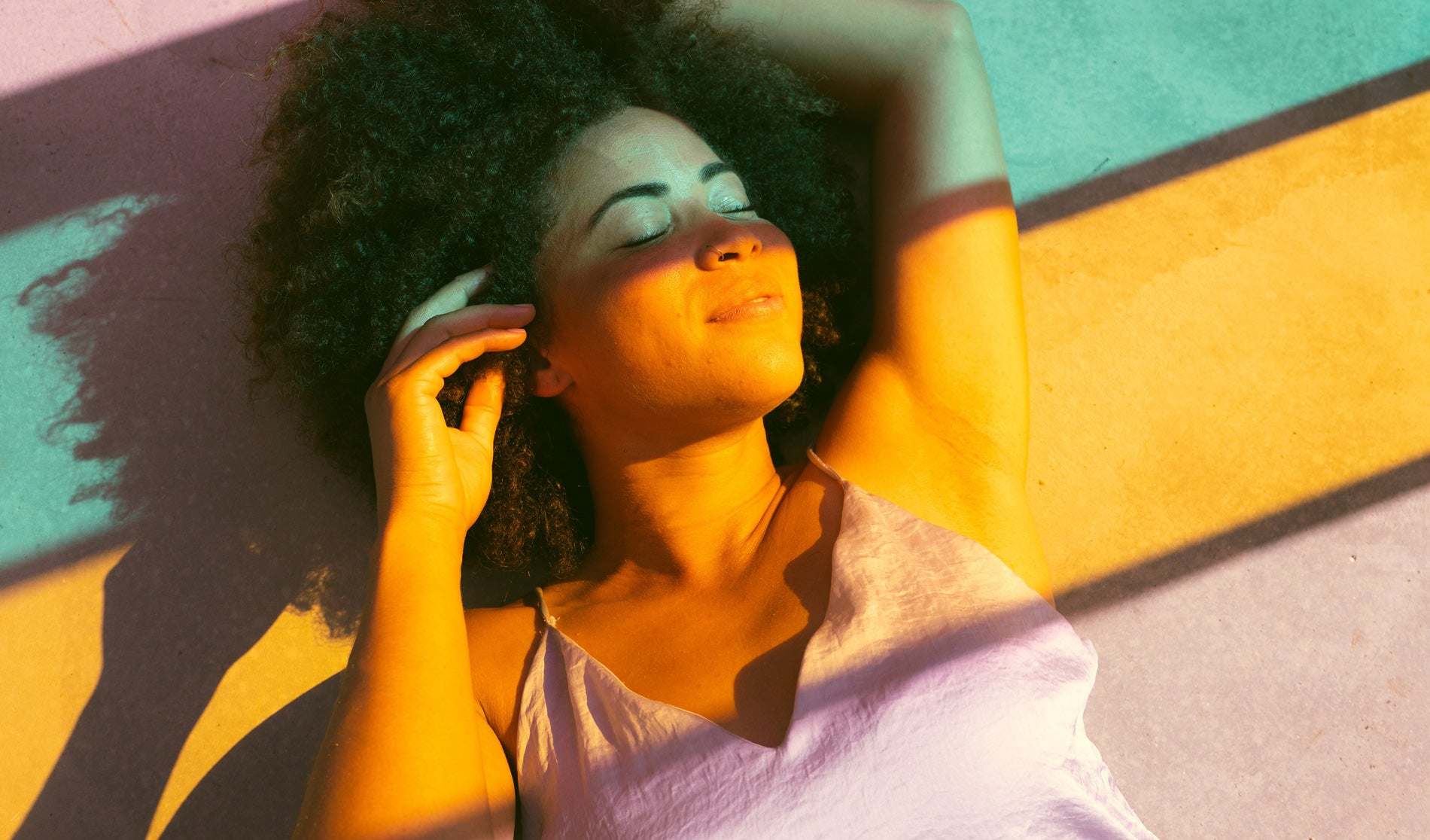 A girl happy because her health is transformed and she possibly used an organic cbd product