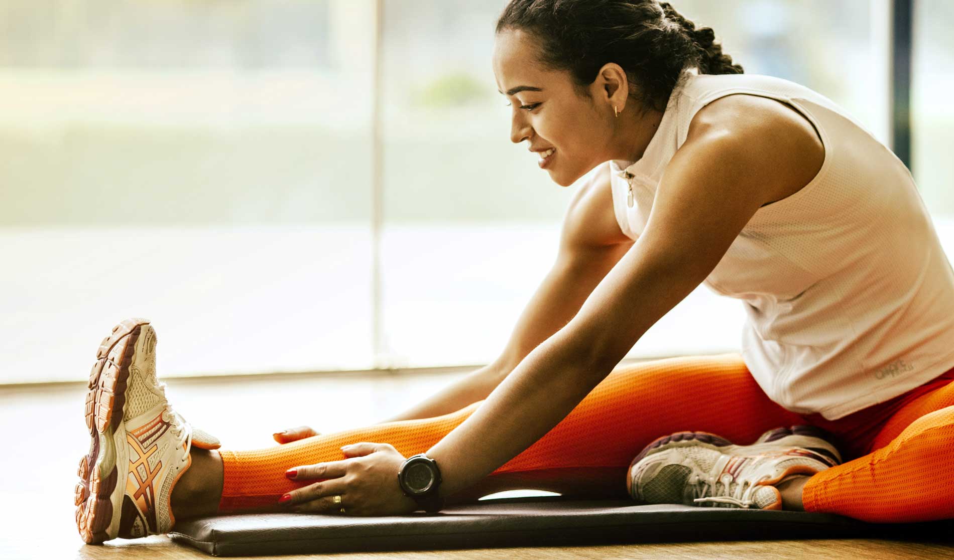 A picture of a fitness women stretching and adding value to her wellness, because wellness matters.